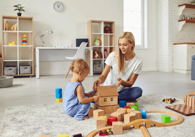  Mom playing with children, really engaging in the activity.