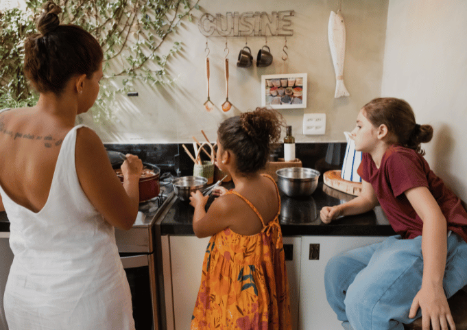 Mom making dinner, focusing on the aromas and textures of the food.